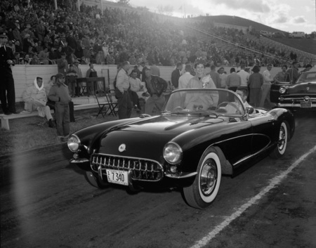 An automobile on the sidelines of the Homecoming game.
