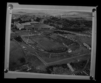 A birds eye view of University of Idaho's Neale Stadium, fans fill the grandstands during a game.