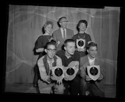 High school students pose holding their awards from a journalism conference.