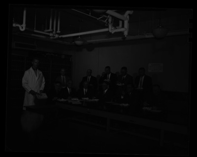 College of Agriculture committee members eating ice cream in the Dairy Science building together.