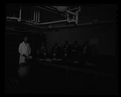College of Agriculture committee members eating ice cream in the Dairy Science building together.