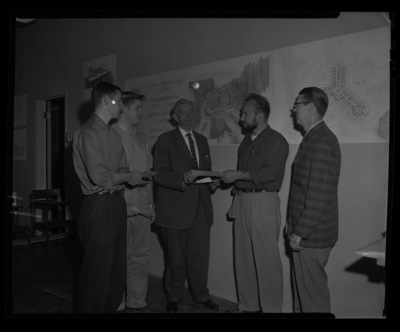 University of Idaho Professor Ted Prichard (center) and Charles Bartlett (far right) from the Art Department with top student design winners.