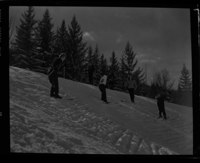 Women on a hill with skiis on out in the snow in MacLean Field as a part of the University of Idaho women's ski club.