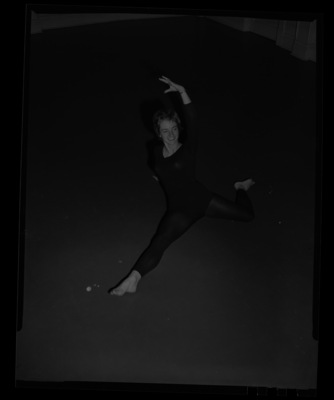 University of Idaho Orchesis, modern dance honor society, dance officer Mary Jo Powers doing a dance pose.