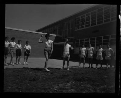 Students throw shot put for a physical fitness class outside the Moscow Middle School.