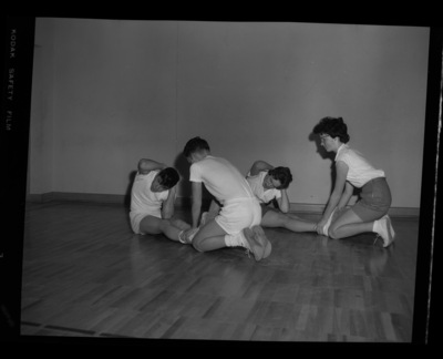 Students stretching for a physical fitness class at the Moscow Middle School gymnasium.