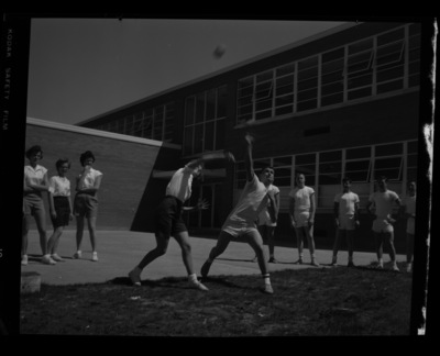 Students throw shot put for a physical fitness class outside the Moscow Middle School.