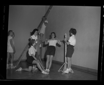 Students exercising for a physical fitness class at the Moscow Middle School gymnasium.