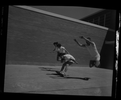 Students compete in a long jump for a physical fitness class outside the Moscow Middle School.