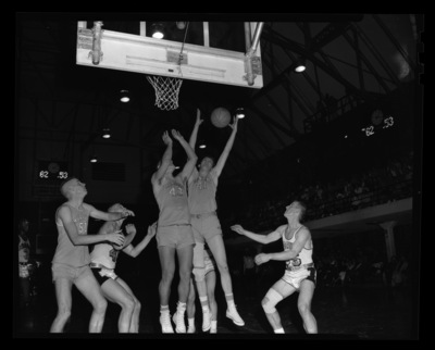 Montana State players try to recover the ball at a University of Idaho vs. Montana State basketball game in Memorial Gym.