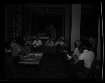 Students and faculty attending the Public Utilities Executive course sitting together in the lounge area of the Student Union Building.