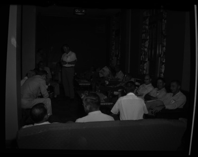 Students and faculty attending the Public Utilities Executive course sitting together in the lounge area of the Student Union Building.