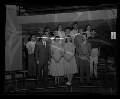 Group photo of students standing on risers in Memorial Gym.