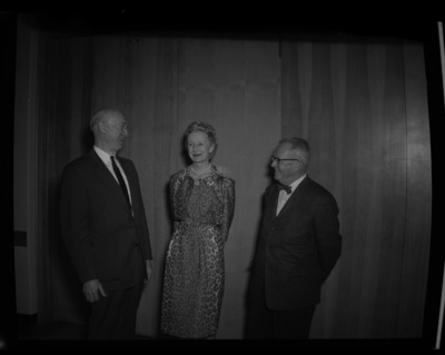 Newspaper columnist and 1959 Commencement speaker, Inez Callaway Robb (center), standing with two unidentified men.