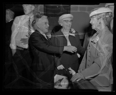 Three women alumni talking at the Alumni Reunion Dinner held the the Moscow Hotel in 1959. 1905 alumnus Mary McFarland Wahl on right.