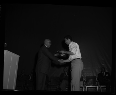 President Theophilus giving awards to outstanding students.