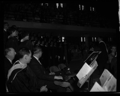 The University of Idaho Vandaleers perform as the University Symphony Orchestra looks on at commencement.