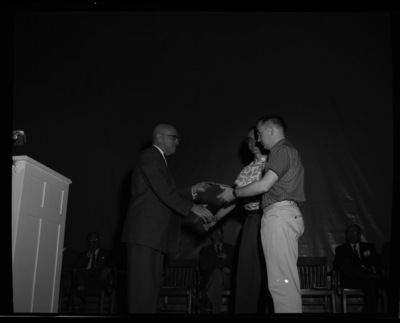 President Theophilus giving awards to outstanding students.