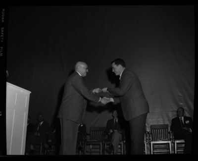 President Theophilus giving awards to outstanding students.