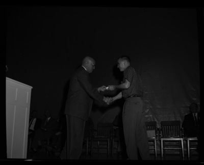 President Theophilus giving awards to outstanding students.