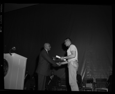 President Theophilus giving awards to outstanding students.