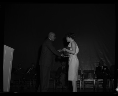 President Theophilus giving awards to outstanding students.