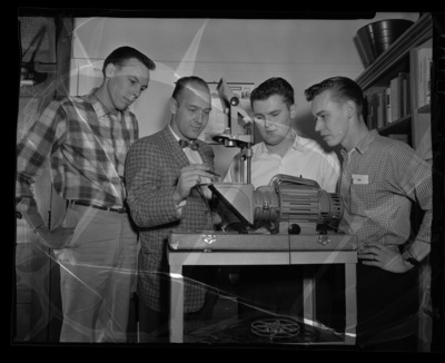 Mr. Paul Kaus showing a Keystone Overhead Projector to students in his Audio-Visual Aids class.