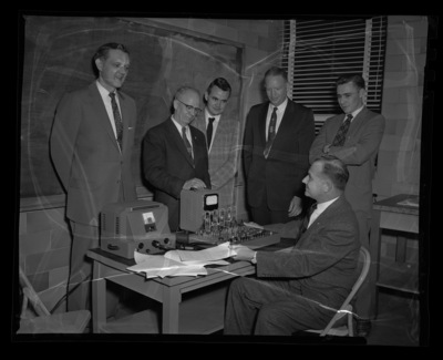IBM representative H.B. Riggs and engineering faculty members (l-r) Dean of Engineering Alan S. Janssen, Vice President H. Walter Steffans, unidentified, Electrical Engineering professor Hubert E. Hattrup, unidentified.