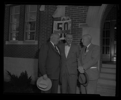 Dean of Forestry Ernest W. Wohletz (center) and 1928 graduate Charles A. Connaughton (right) and an unifentified alumni (left) at the welcome ceremony for the College of Forestry's 50th Anniversary celebration at the University of Idaho's music building.
