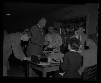 Attendees at the College of Forestry's 50th Anniversary Banquest line up to recieve their names badges for the event.