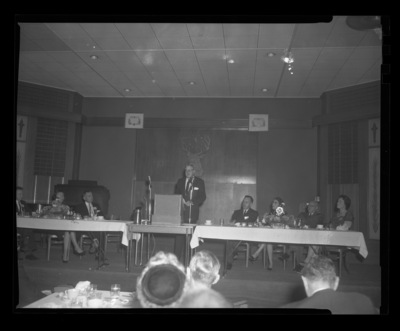 Henry Clepper, executive secretary for the  Society of American Foresters, gives the keynote address for the College of Forestry's 50th Anniversary celebration. From (l-r) Mrs. Wohletz, Dean Ernest Wohletz, Henry Clepper, unidentified, unidentified, President Theophilus, and Mrs. Theophilus.