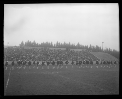 The Vandalettes march on the field at Neale Stadium for the Homecoming game.
