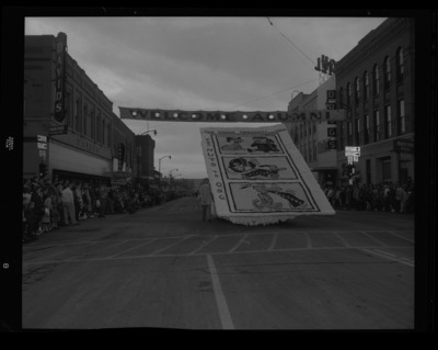 Homecoming float group contest winner, built by Phi Gamma Delta and Kappa Kappa Gamma, shows a Peanuts cartoon on Main Street in downtown Moscow during the homecoming parade
