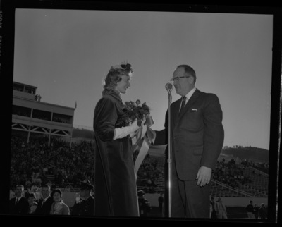 Homecoming queen Trenna Atchley being presented by Elbert Stellmon at the 1959 Homecoming Game.