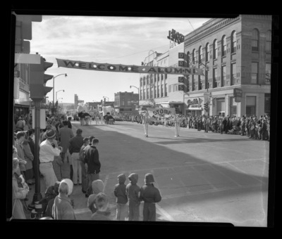 The Homecoming parade in downtown Moscow holding a banner that reads "stop the web-foots".