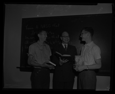 Dr. Kenneth Bush, professor of mathematics, awarding freshman math winners.