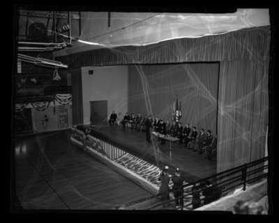 Lt. Governor William Drevlow presents an award to a student at the combined ROTC awards ceremony at the University of Idaho.
