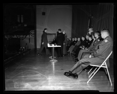Major General F.M. Day presents an award to a student at the combined ROTC awards ceremony at the University of Idaho.