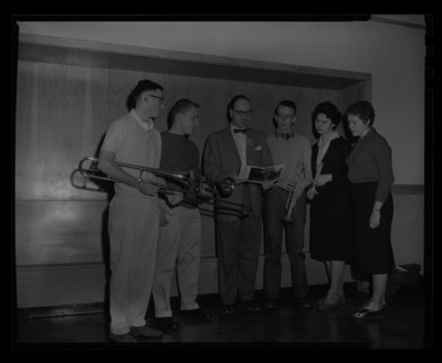 Dean of Music, Hall Macklin, shows a pamphlet about the University of Idaho to visiting high school music students.