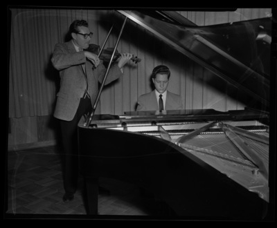Professor LeRoy Bauer from the Music Department plays violin and Steve Romanio plays piano.