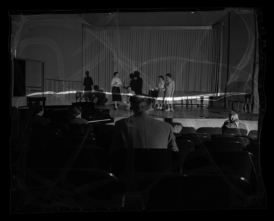 Students rehearse a scene from The Magic Flute for the annual "Evening of Opera" workshop presented by the School of Music. From left to right: Julie Gerard, Chet Earls, Ione Hinckle, Billie Sommers (in her Spur uniform)