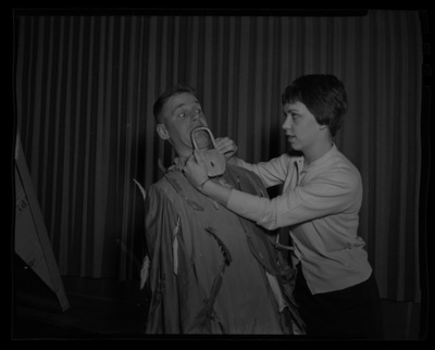 Chet Earls, left, dressed as Papageno and Vicki Fisher, right, in a rehearsal for scenes from The Magic Flute for the annual "Evening of Opera" workshop presented by the School of Music.