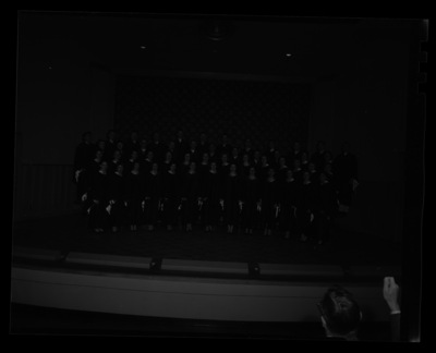 School of Music Vandaleers preform with a conductor in the foreground.