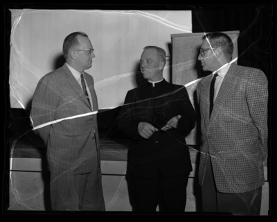 Rev. Daniel Linehan (center) from Boston College with College of Mines Dean, Earl F. Cook (left), and faculty member Guy Anderson (right).