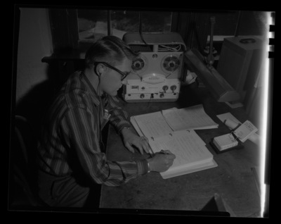 Graduate student in Zoology, Ron Purviance, listens to a recorded class lecture in parisitology and takes notes.
