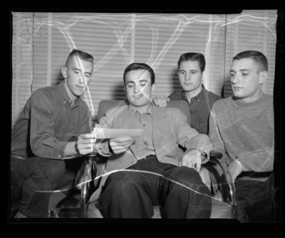 Interfraternity Council (IFC) donating $100 to Iranian student.