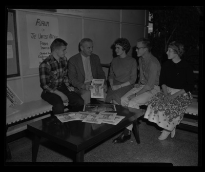 Jim Lyle, alumni director, talking with students in the Student Union Building.