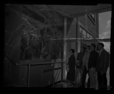 High school honor students looking at the mural in the Agricultural Science Building.