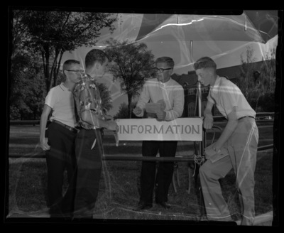 Students at information booth at University of Idaho outside the Administration Building.