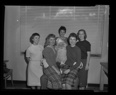Holly Queen candidates posing with Santa.